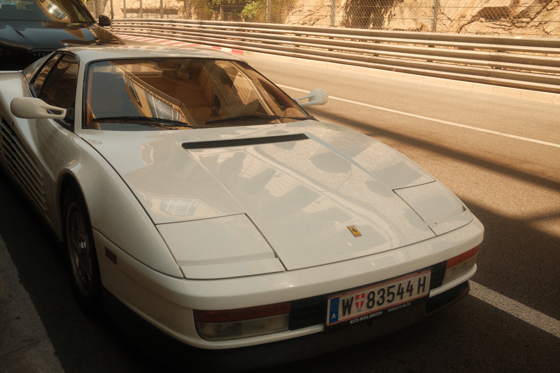 Red Ferrari Testarossa parked on a Monaco street